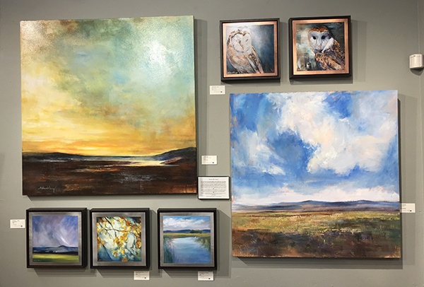 Alisa Huntley's wall of fine art at Tumalo Art Co.