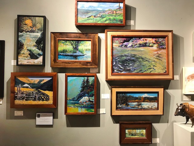 David Kinker's wall of paintings and his hand-made custom frames