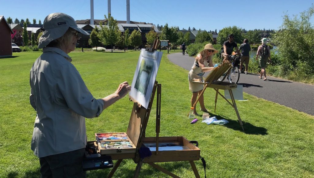 artists in action in the old mill district