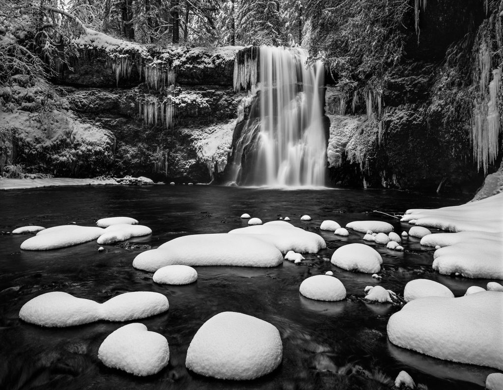 "Just Rewards" is a fine art photograph of a waaterfall in winter by Bruce Jackson.