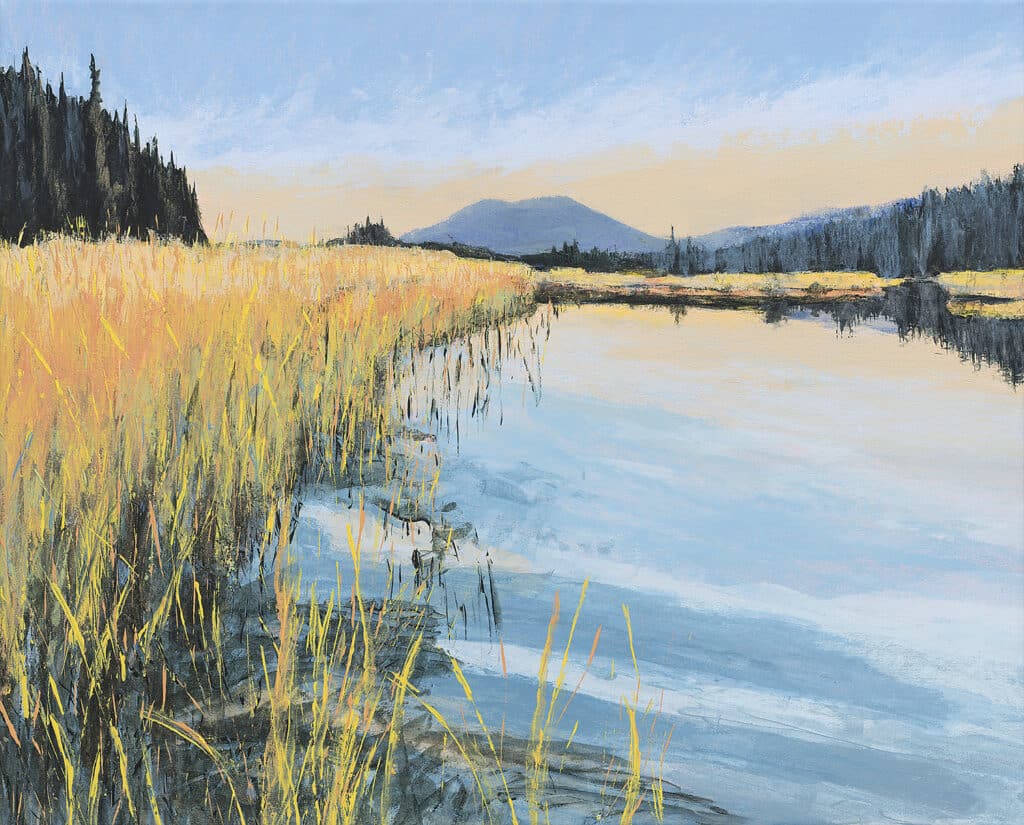 Water with mountain in the distance and yellow grasses. An acrylic painting by Anne Gibson